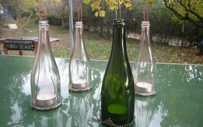 Des photophores avec la partie supérieure des bouteilles de champagne!